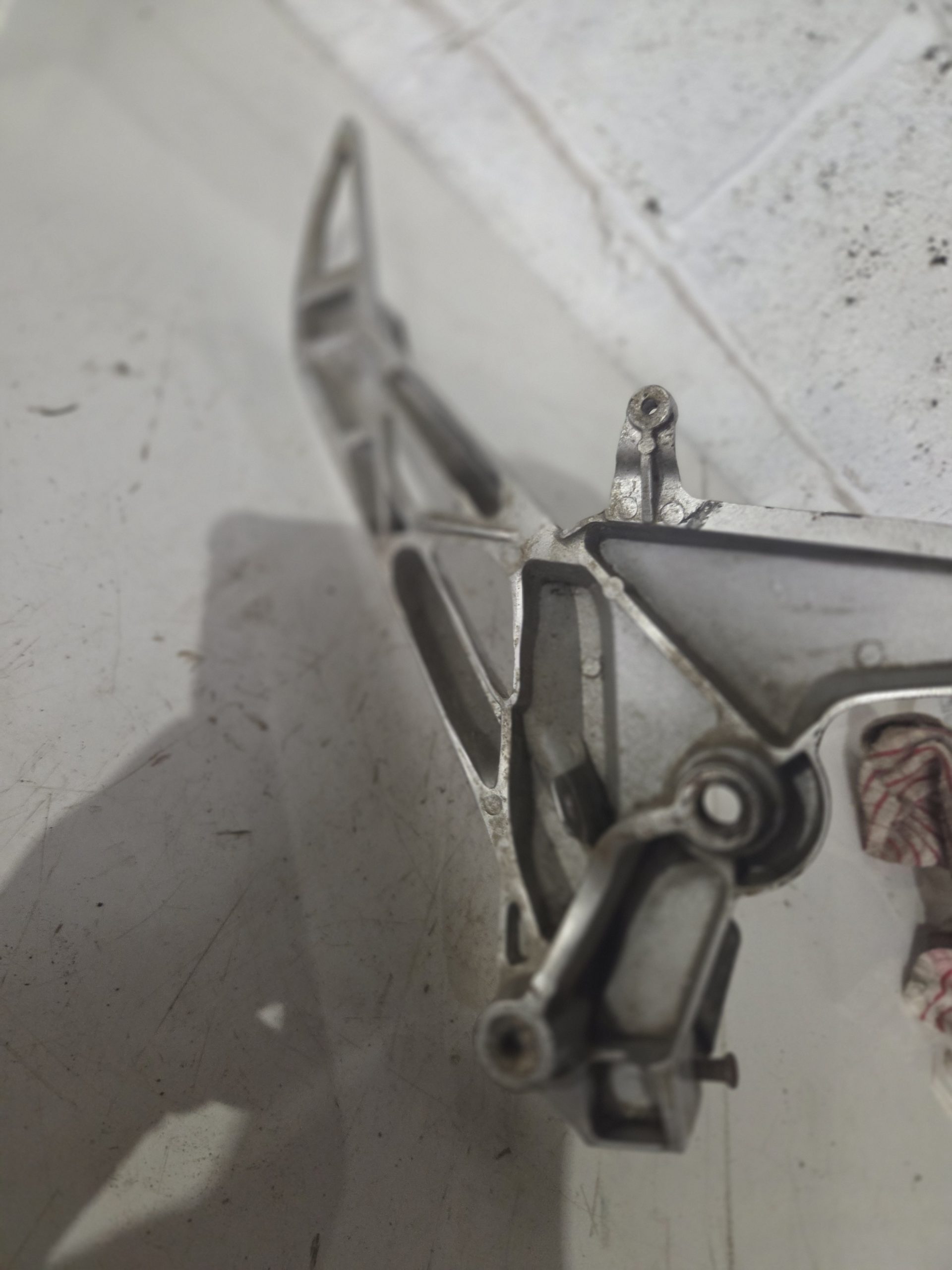 Honda CBF 2019 Left side foot peg hanger with foot peg